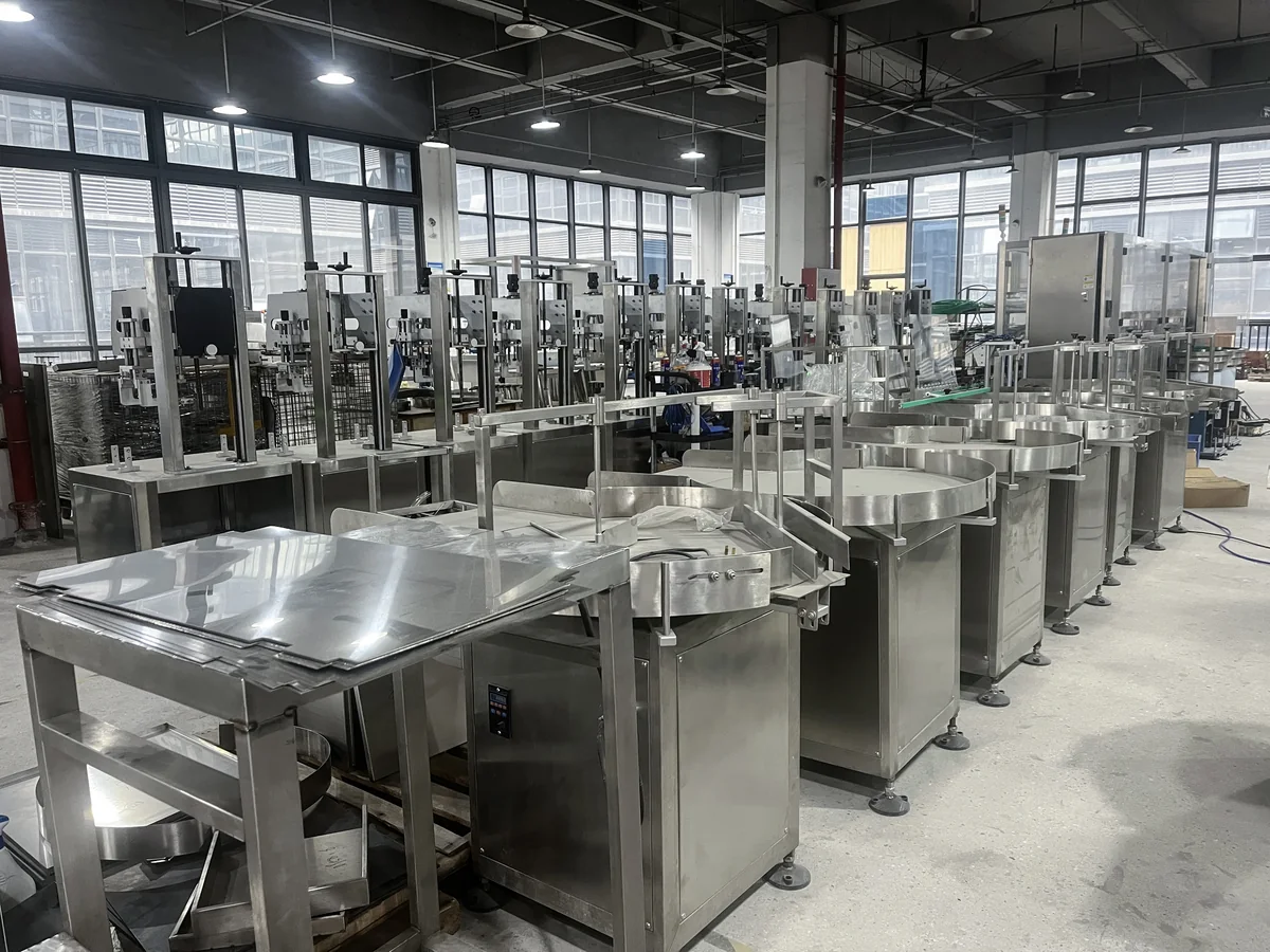 Rows of stainless steel packaging machines in the ZXSMART workshop